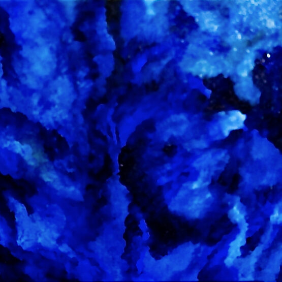 Vivid blue and black abstract painting displayed on a wooden easel, with deep hues and swirling patterns suggesting a sense of depth and movement.